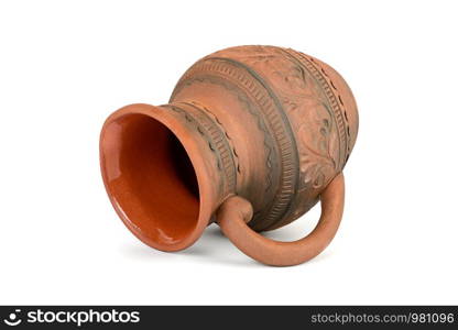 Lying earthenware jug isolated on white background.