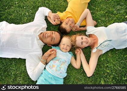 lying family grass 2