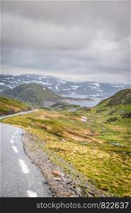 Lysevegen road running through summer norwegian mountains, located in Rogaland county. Beautiful landscape. Travel and tourism.. Road landscape in norwegian mountains