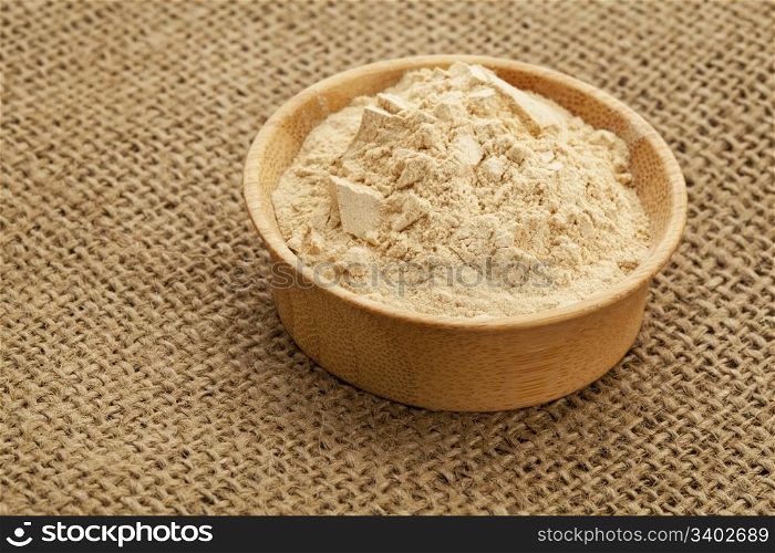 maca root powder (nutrition supplement - superfood from Andies) in a wood bowl