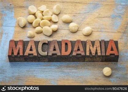 macadamia nuts with a word spelled in letterpress wood type