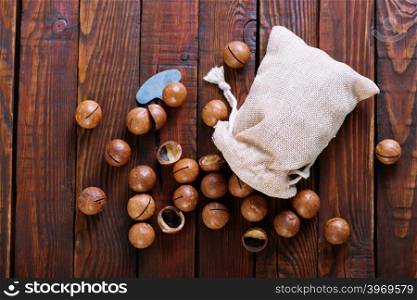 macadamia on a table, nuts in bag and on a table