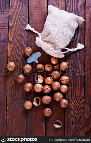 macadamia on a table, nuts in bag and on a table