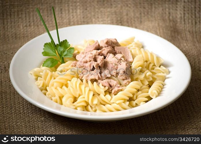 macaroni pasta with tuna in a white plate