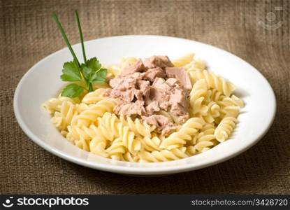 macaroni pasta with tuna in a white plate