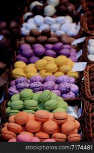 Macarons in different colors and flavors on a a market