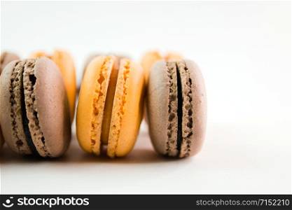 Macaroons on white background top, colorful macaroons, selective focus.. Macaroons on white background top, colorful macaroons, selective focus