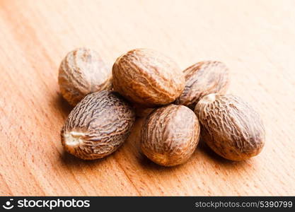 Mace spice scattered on wooden table