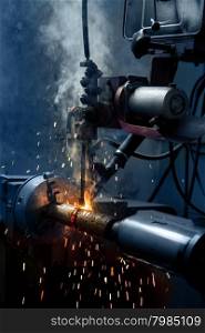 Machine Welds the Metal and Makes a Lot of Sparks and Smoke