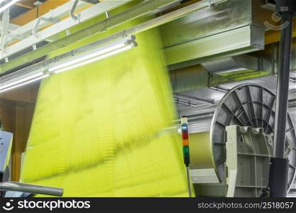 Machinery and equipment in the weaving shop, detailed review. interior of industrial textile factory. weaving workshop at the factory