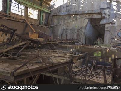 machinery destroyed in a coal mine abandoned after the war