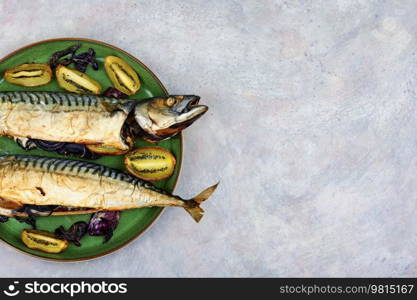 Mackerel fish baked with kiwi pieces. Menu recipe place. Copy space. Food recipe background.. Grilled mackerel fish, space for text