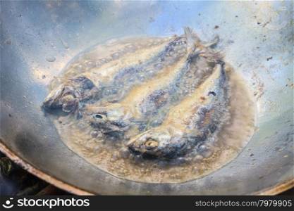 Mackerel fried in a pan, cooking in the Thai kitchen
