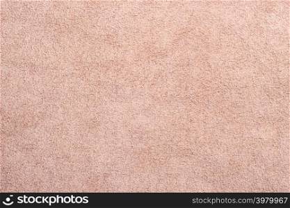 Macro bright beige suede soft leather as texture background