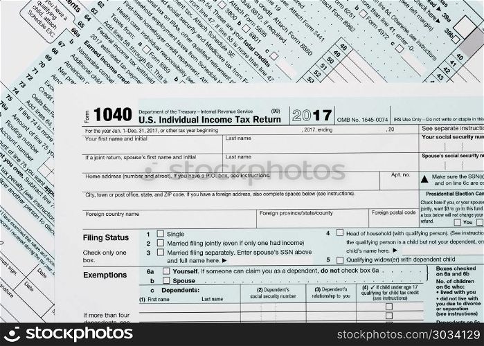 Macro close up of 2017 IRS form 1040. Close macro photo of USA IRS tax form 1040 for year 2017 taken from above. Macro close up of 2017 IRS form 1040