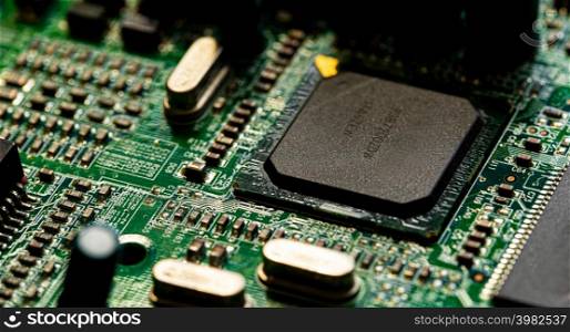 Macro Close up of components and microchips on PC circuit board of modem router