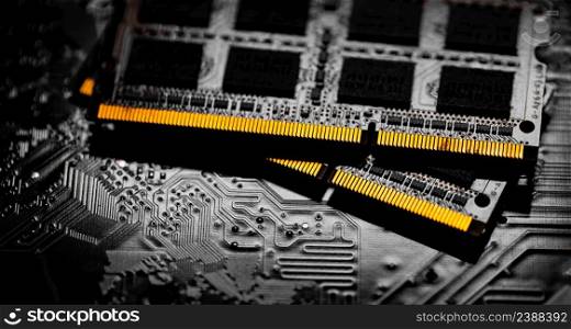 Macro Close up of computer RAM chip and motherboard on dark background