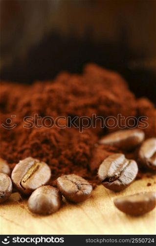 Macro image of coffee beans and ground coffee