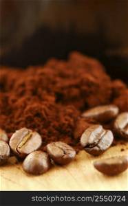 Macro image of coffee beans and ground coffee