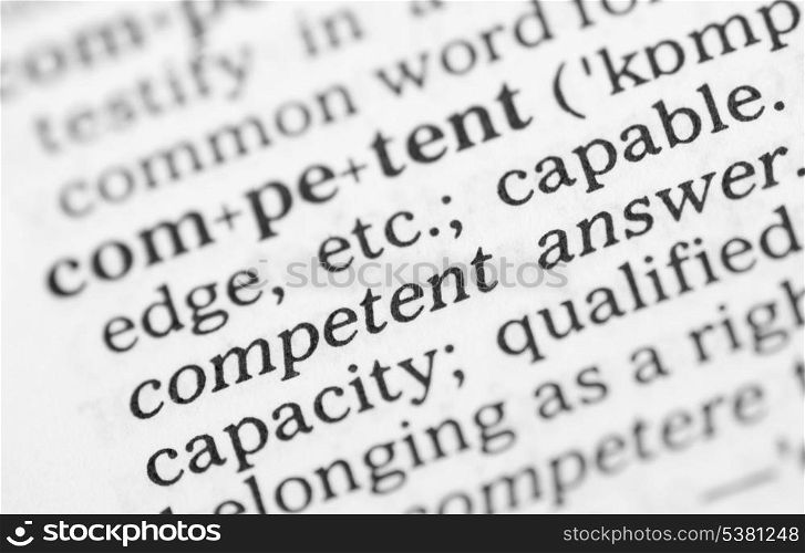 Macro image of dictionary definition of competent. Macro image of dictionary definition of word competent