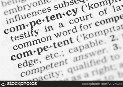Macro image of dictionary definition of word competency