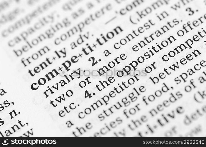 Macro image of dictionary definition of word competition