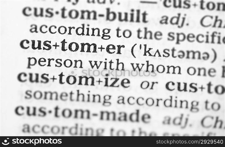 Macro image of dictionary definition of word customer