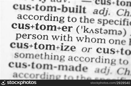 Macro image of dictionary definition of word customer