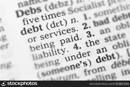 Macro image of dictionary definition of word debt. Macro image of dictionary definition of debt