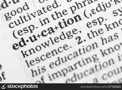Macro image of dictionary definition of word education