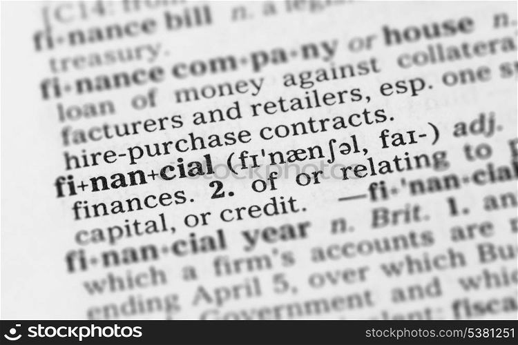 Macro image of dictionary definition of word financial. Macro image of dictionary definition of financial