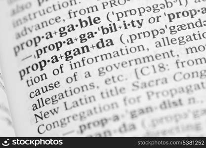 Macro image of dictionary definition of word propaganda. Macro image of dictionary definition of propaganda