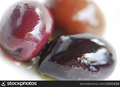 Macro image of greek kalamata olives and olive oil