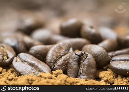 Macro image of ground coffee and coffee beans