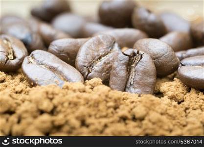 Macro image of ground coffee and coffee beans