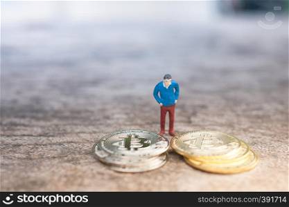 Macro man figure thinking to invest bitcoin. virtual cryptocurrency invest concept