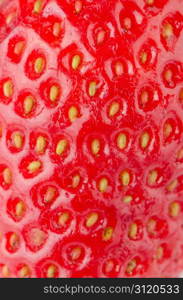 Macro of a red ripe strawberry texture.