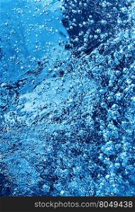 Macro of blue ice texture with frozen bubbles