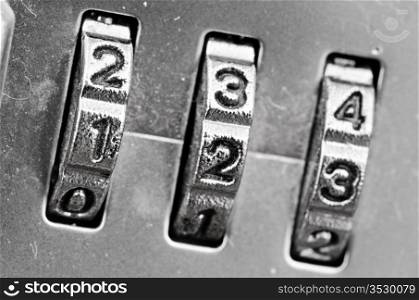 Macro of combination lock - dials set to 123, Selective focus on first dial
