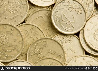 Macro of many coins cents Euro as background