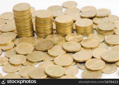 Macro of many coins cents Euro on a over white background