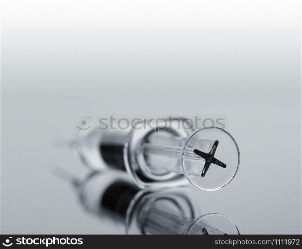 Macro of medical syringe with vaccine. Toned