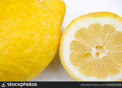 Macro of one and a half a lemon on white dish