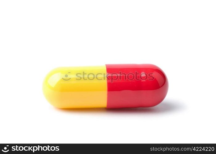 macro of red and yellow capsule pill isolated