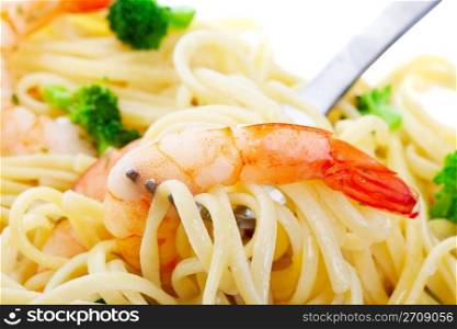 Macro of Shrimp Linguini with broccoli. Focus on shrimp.