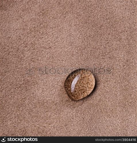 macro photo of water drop on brown leather background. macro photo of water drop on leather