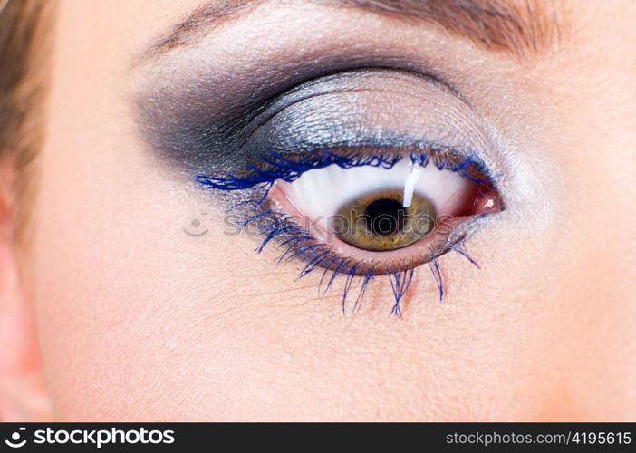 macro shot of a female eye with fashion make-up