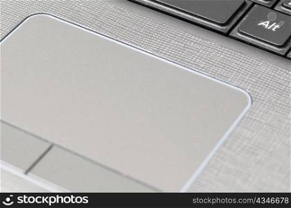 macro shot of a gray laptop touchpad