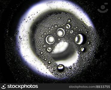 macro shot of bubbles, drops of fat on water look like penguin