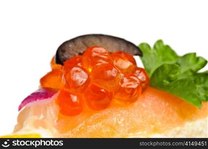 macro shot of canape with red caviar, cmoked salmon and vegetables . canape with red caviar